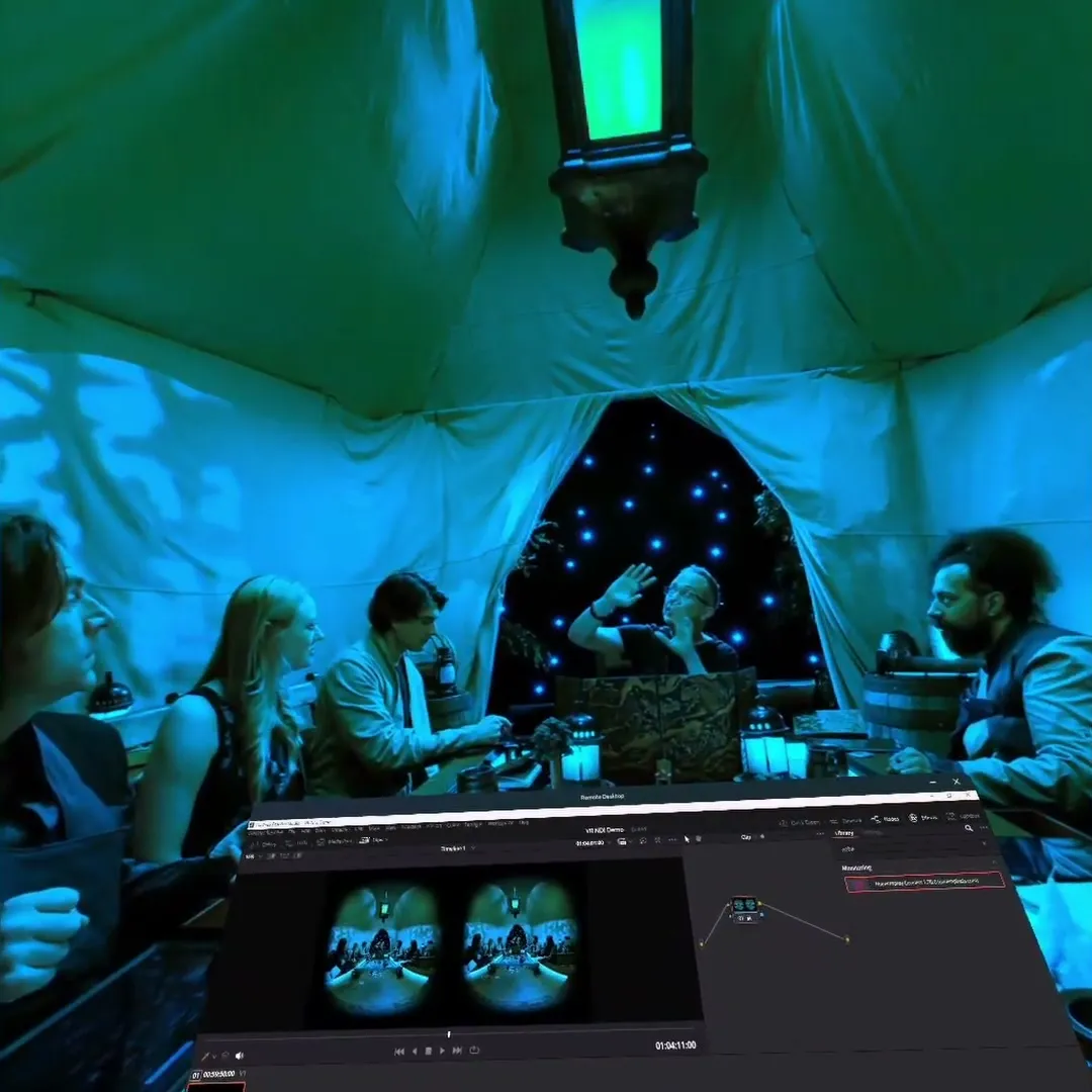 A 180° dinner-table scene turned deep blue by a grade change made in the Resolve window docked below it.